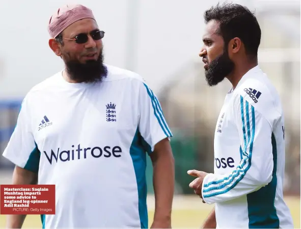  ?? PICTURE: Getty Images ?? Masterclas­s: Saqlain Mushtaq imparts some advice to England leg-spinner Adil Rashid