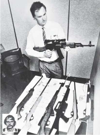  ?? PHOTO: JON CAMERON ?? Deadly weapons . . . Detective Sergeant Gary Binney holds David Gray’s .223 Norinco semiautoma­tic assault rifle after the shootings at Aramoana. The rest of the guns are Gray’s arsenal. Inset: David Gray.