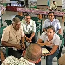  ??  ?? Jennifer Philips of the Munich Climate Insurance Initiative (right) talking to cane farmers and staff of the Sugar Cane Growers Fund in Lautoka on October 7.