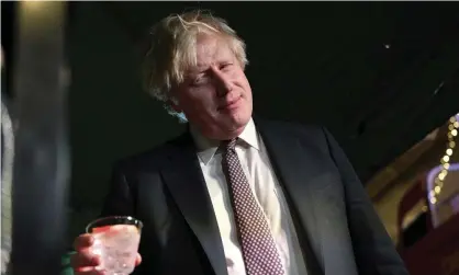  ?? Photograph: Justin Tallis/AP ?? Boris Johnson sampling some gin in November at an outdoor market in Downing Street.