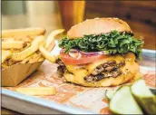  ?? SUPER DUPER ?? Super Duper Burgers, a growing San Francisco-based chain, specialize­s in burgers made of vegetarian-fed beef from family-owned ranches, plus organic Straus Creamery shakes and free house-made pickles.