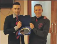  ??  ?? Iain MacMillan was presented with a Loyal Service Award by Lochside manager Gareth Evans.