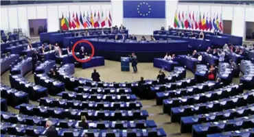  ??  ?? Spot the MEP: Row after row of empty seats as Mr Juncker (circled) speaks yesterday