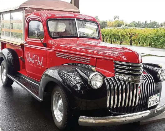  ??  ?? Visitors tour Round Pond Estate in this 1941 red Chevrolet truck. — Photos: ERROL OH/ The Star