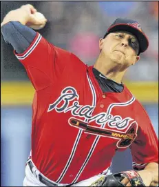  ?? HYOSUB SHIN / HSHIN@AJC.COM ?? Atlanta Braves pitcher Kris Medlen (54) delivers a pitch against the Washington Nationals in the first inning at Turner Field Friday.