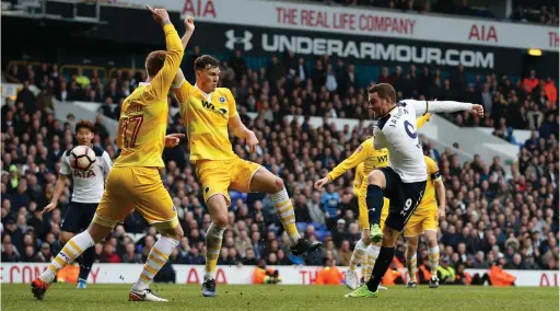  ??  ?? SWEETLY STRUCK: Vincent Janssen scores his first goal in open play as Tottenham crushed Millwall 6-0 in the FA Cup yesterday.