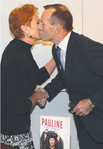  ?? Picture: KYM SMITH ?? Former prime minister Tony Abbott launches Senator Pauline Hanson’s first book in 11 years Pauline, In Her Own Words, at Parliament House in Canberra yesterday.