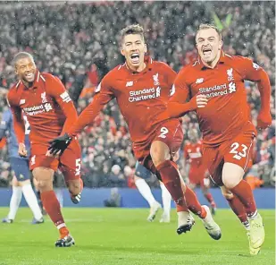  ?? — Gambar Reuters ?? BUKTI KEHEBATAN: Shaqiri ( kanan) meraikan jaringanny­a bersama rakan sepasukan ketika membantu Liverpool menewaskan United pada aksi liga di Anfield, Liverpool pada Ahad lepas.