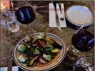  ?? KATE BRADSHAW — STAFF ?? Wine and shared plates, like a roasted root vegetables dish — featuring both Romesco sauce and Romanesco cauliflowe­r — are among the menu items at Voyage Bar in San Anselmo.