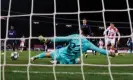  ?? Photograph: Andrew Boyers/ Action Images via Reuters ?? Paulo Gazzaniga stretches out a left boot to deny Red Star’s Milan Pavkov in the first half.