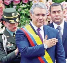  ??  ?? CEREMONIA. El nuevo presidente pidió la unidad de todos los colombiano­s.