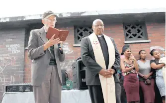  ??  ?? Paddy Kearney’s commitment to the poorest in Durban continued throughout his life. Here he is with Cardinal Wilfrid Napier OFM, the Archbishop of Durban, at the blessing of the Denis Hurley Centre’s satellite clinic amid the grime and neglect of the old Dalton Beer Hall.