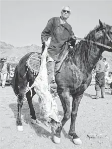  ?? JIM MICHAELS, USA TODAY ?? The Afghan game of buzkashi (the literal translatio­n is “goat bashing ”) is played on horseback with a goat carcass.