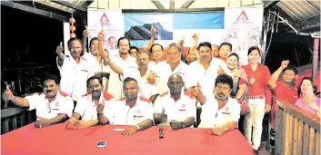  ??  ?? Ramasamy (seated middle), Balasubram­aniyam (seated second right), Devendran (seated second left) and Manogaran (seated right) with MIRA leaders and members.