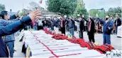  ?? ?? People attend a mass funeral of civilians who were mistakenly killed by security forces, in Mon district of the northeaste­rn state of Nagaland, India (REUTERS)