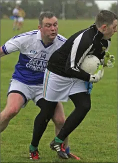  ??  ?? Ballyhogue captain Edward Galavan puts pressure on Ricky Rochford.