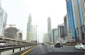  ?? Clint Egbert/Gulf News ?? Dust-laden air fills the sky over Shaikh Zayed Road. Hot and dusty weather prevailed in ■ many parts of the country yesterday, and is expected to continue till Monday.