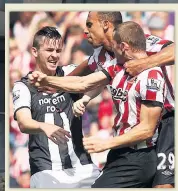 ??  ?? HE’S GOT HISTORY Barton clashes with Black Cat pair Anton Ferdinand and Phil Bardsley as tempers boiled over in the 2011 Tyne-Wear derby