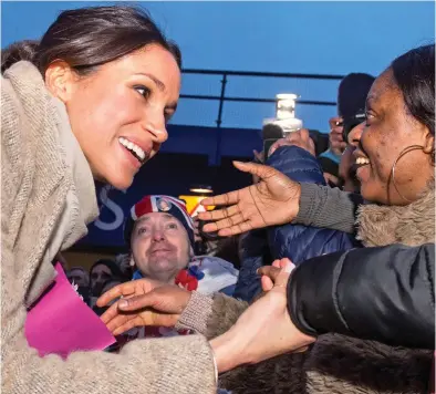  ??  ?? A right royal welcome: Miss Markle meets fans during an official engagement in London