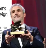  ?? — Relaxnews photo ?? Director Alfonso Cuaron with the Golden Lion for ‘Roma' at the 75th Venice Film Festival on Sept 8, 2018.