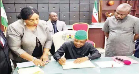  ??  ?? L-R: Clerk of Imo State House of Assembly (IMHA), Chinelo Emeghara; Imo State Governor, Hon. Emeka Ihedioha; and Majority Leader IMHA, Hon. Modestus Nwaneri, during the signing of the Amended Universal Education Law, at the Government House, Owerri, Imo State…yesterday