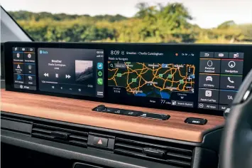  ??  ?? ABOVE
The flat-fronted dashboard has no fewer than five screens across it.
