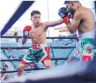  ?? COURTESY OF ANGELO LEO ?? Albuquerqu­e native Angelo Leo, left, lands a left jab against Alberto Torres during their February bout, won by Leo via unanimous decision.