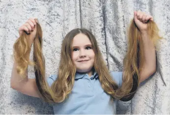  ?? ?? Ella is donating her long locks to the Little Princess Trust.