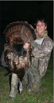  ?? (Photo courtesy of Sheffield Nelson) ?? While battling cancer during the 2009 spring turkey season, the author killed his first mature gobbler in Arkansas while hunting with Sheffield Nelson in Phillips County at Jackson Point.