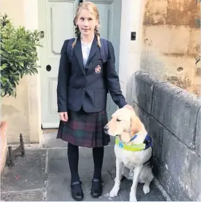  ??  ?? Hester Poole, 11, with her guide dog