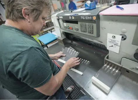  ?? LIAM RICHARDS ?? Gladys Olfert prints ballots for the upcoming Saskatoon Fairview byelection at Linda’s Printing on Thursday. Five candidates from major parties are running for the seat vacated in June by Jennifer Campeau, who left to take a job in British Columbia.