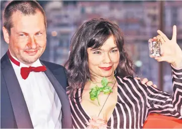  ??  ?? This file photo taken on May 21, 2000 shows Danish director Lars Von Trier (left), at the 53rd Cannes Film Festival Golden Palm for his movie 'Dancer in The Dark', posing with Icelandic pop star and actress, Bjork, Best Actress, on the terrace of the...