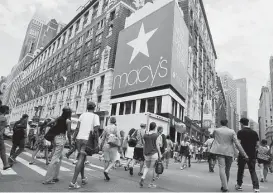  ?? Jin Lee / Bloomberg ?? Macy's has its flagship store in New York. The Cincinnati-based company earned $1.3 billion, or $4.31 per share, in the fourth quarter.