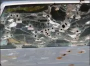  ?? ASSOCIATED PRESS FILE ?? The front windshield of the car driven by Timothy Russell is shown in 2015 in Cleveland.