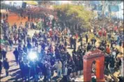  ??  ?? Protesters gather around a replica of the India Gate set up at Shaheen Bagh in New Delhi, on Tuesday.
ANI