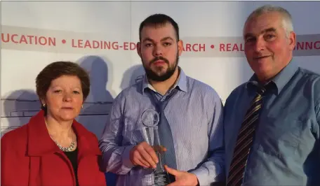  ??  ?? Timmy Angland, Meelin who recently received the ‘2016 Best Apprentice in Motor Mechanics Award’ in CIT, pictured here with his parents Nellie and John. Timmy completed his apprentice with Cavanaghs of Charlevill­e.