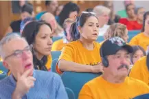  ??  ?? Marcela Diaz, left, executive director of Somos Un Pueblo Unido, and Elvira Amador were among a crowd of about 200 at a Monday meeting of the legislativ­e Courts, Correction­s and Justice Committee in Santa Fe.