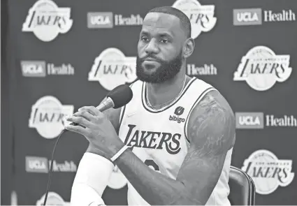  ?? JAYNE KAMIN-ONCEA/USA TODAY SPORTS ?? Los Angeles Lakers star LeBron James answers questions during media day on Tuesday. The NBA legend recently said he has been vaccinated.