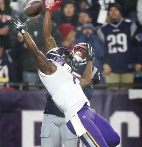  ?? NANCY LANE / BOSTON HERALD ?? SKY’S THE LIMIT: J.C. Jackson breaks up a pass for the Vikings’ Aldrick Robinson during the Patriots’ regularsea­son victory. Jackson will draw a tough matchup Sunday when the Pats face the Chargers.