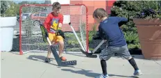 ?? MICHELLE ALLENBERG/WELLAND TRIBUNE ?? Alexander Colangelo, 7, tries to stop a ball from going in the net during a fun ball hockey game during Vale Day at Vale Community Health and Wellness Centre on Saturday in Port Colborne.