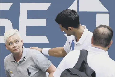  ?? PICTURE: AL BELLO/GETTY IMAGES ?? 0 Novak Djokovic apologises to the US Open line judge whom he struck with a tennis ball.