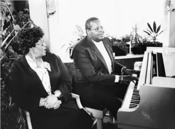  ??  ?? Oscar Peterson and Ella Fitzgerald performing at a piano together, at a press reception at Grosvenor House Hotel, London, in 1980 (Getty)