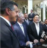  ?? THE ASSOCIATED PRESS ?? In this Sept. 4, 2014, file photo, Nevada Gov. Brian Sandoval, from left, executive director of the Governor’s office of economic developmen­t Steve Hill and Telsa Motors CEO Elon Musk answer questions following a news conference at the Capitol in Carson City, Nev.