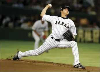  ?? PHOTO/TORU TAKAHASHI ?? In this Nov. 19, 2015, file photo, Japan’s starter Shohei Otani pitches against South Korea during the first inning of their semifinal game at the Premier12 world baseball tournament at Tokyo Dome in Tokyo. A person familiar with the decision says...