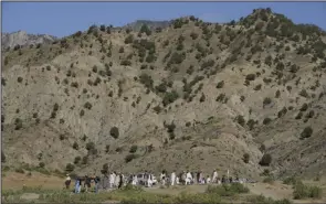  ?? (AP/Ebrahim Nooroozi) ?? Afghans carry a relative killed in an earthquake to a burial site Thursday in Gayan village, Paktika province, Afghanista­n.