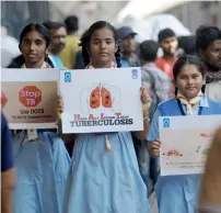  ?? AFP ?? Schoolchil­dren hold placards as they take part in a tuberculos­is awareness campaign in Chennai, on World Tuberculos­is Day.—