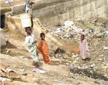  ??  ?? Child labour? Some Almajirai are sometimes hired to sweep and clear culverts