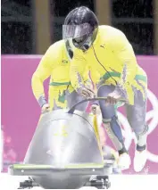  ?? AP ?? Jamaica’s Winston Watts and brakeman Marvin Dixon during the 2014 Winter Olympics in Krasnaya Polyana, Russia.