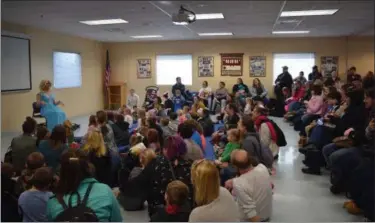  ?? MARIAN DENNIS — MEDIANEWS GROUP ?? Drag Queen Story Hour packed an activity room at the Exeter Community Library Saturday. While the room was filled with attendees, outside the library was also crowded with protesters and counter protesters.