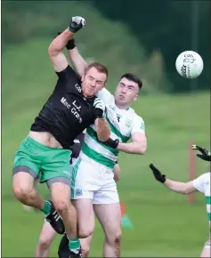  ?? ?? Marty Mcgrath and Paul Doherty contest an aerial ball.